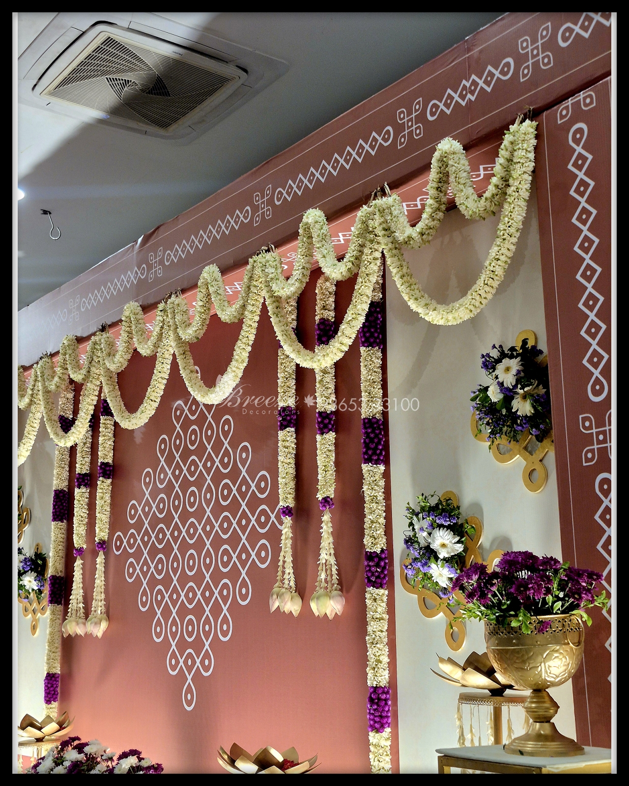 Traditional kolam floral garland backdrop detail for 60th birthday celebration at Kuudam Hall Coimbatore